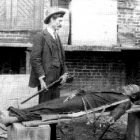 This image of Constable J. L. McGowan standing, rifle in hand, over the corpse of ?Railroad Bill? strapped to a wooden plank, sold for 50 cents in the days following the notorious outlaw's death in March 1896.